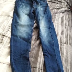 Long pants and a blue purse